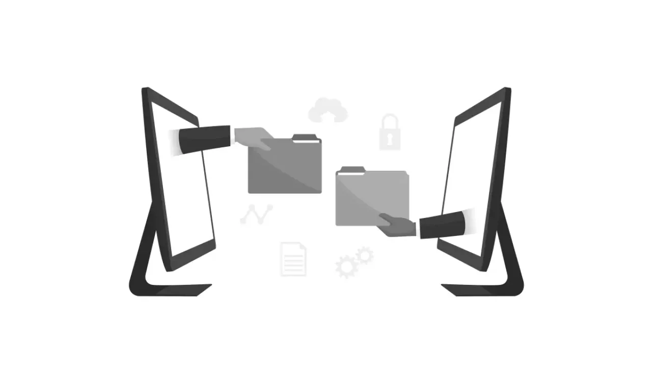 Two hands transfer gray folders between black computer monitors, symbolizing data transfer in a digital landscape.